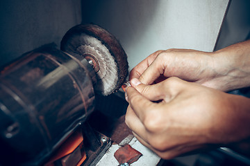 Image showing Different goldsmiths tools on the jewelry workplace. Jeweler at work in jewelry.