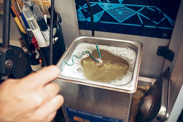 Image showing Different goldsmiths tools on the jewelry workplace. Jeweler at work in jewelry.