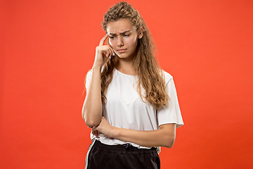 Image showing Young serious thoughtful woman. Doubt concept.