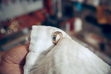 Image showing Different goldsmiths tools on the jewelry workplace. Jeweler at work in jewelry.