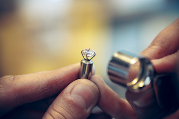 Image showing Different goldsmiths tools on the jewelry workplace. Jeweler at work in jewelry.