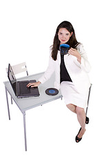 Image showing Sexy Woman Sitting on the Desk