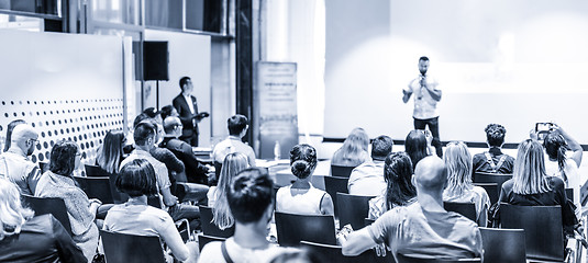 Image showing Male business speaker giving a talk at business conference event.