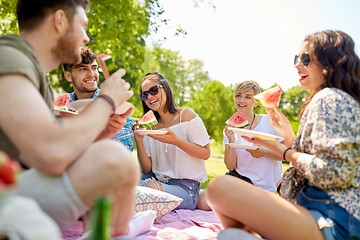 Image showing happy friends eating watermelon at summer picnic