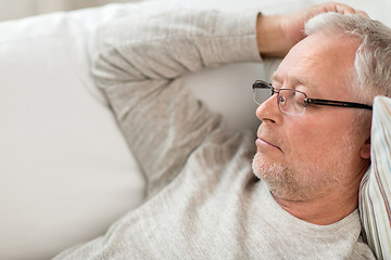 Image showing senior man sleeping on sofa at home