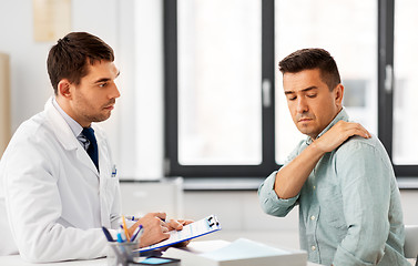 Image showing patient showing sore shoulder to doctor at clinic