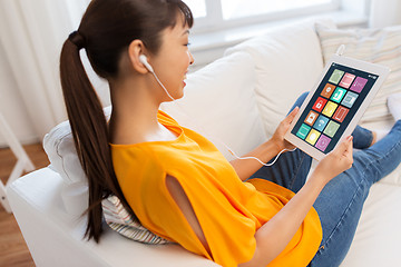 Image showing asian woman with smart home icons on tablet screen