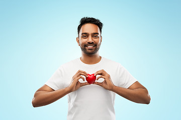 Image showing indian man with red heart over blue background