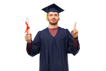 Image showing male graduate student in mortar board with diploma