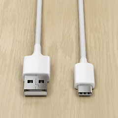 Image showing USB cables on wood