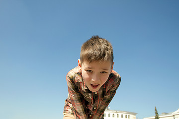 Image showing Happy boy play on square