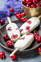 Image showing Homemade vanilla ice cream with cherry.