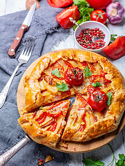 Image showing Open pie with potatoes, bacon and tomatoes.