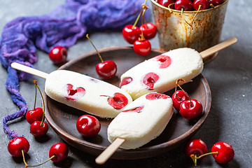 Image showing Artisanal vanilla ice cream with cherry.