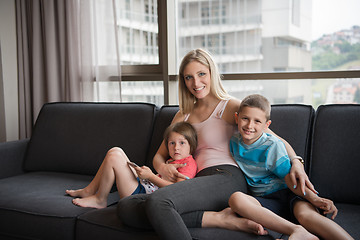 Image showing young mother spending time with kids