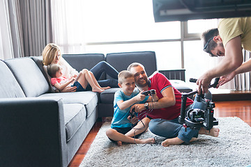 Image showing Happy family playing a video game