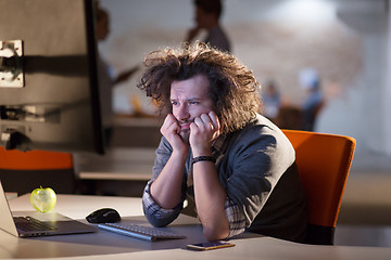 Image showing businessman relaxing at the desk