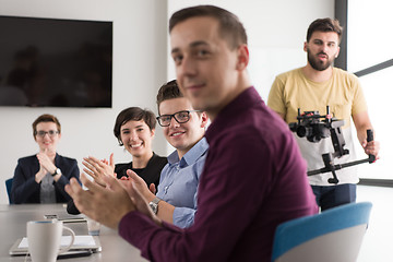 Image showing Group of young people meeting in startup office