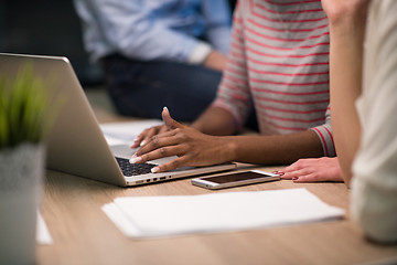 Image showing Multiethnic startup business team in night office