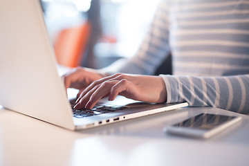 Image showing businesswoman using a laptop in startup office