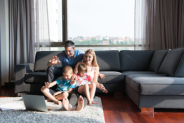 Image showing Family Playing Together with laptop computer