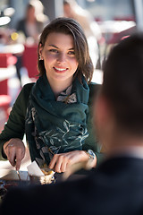 Image showing Closeup shot of young woman and man having meal.