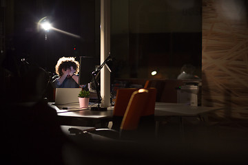 Image showing businessman relaxing at the desk