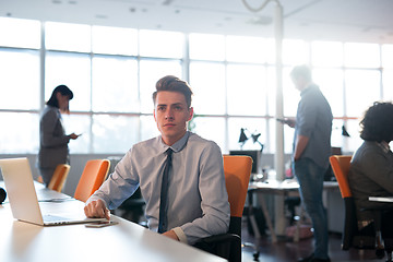 Image showing businessman working using a laptop in startup office