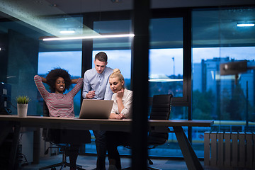 Image showing Multiethnic startup business team in night office