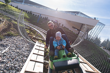 Image showing father and son enjoys driving on alpine coaster