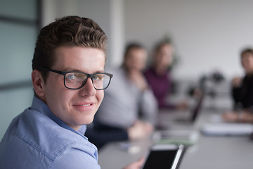 Image showing Businessman using tablet in modern office