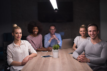 Image showing Multiethnic startup business team in night office