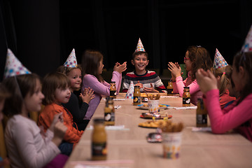 Image showing The young boy joyfully celebrating his birthday