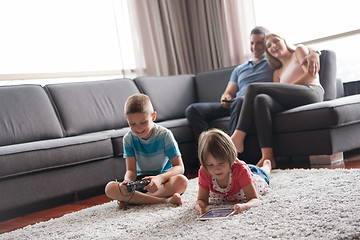 Image showing couple spending time with kids