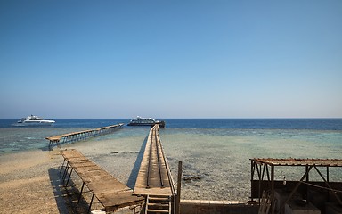 Image showing Long pier with some yachts