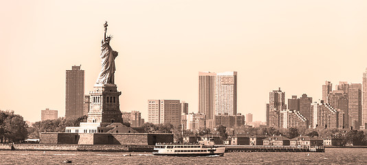 Image showing Statue of Liberty with Liberty State Park and Jersey City skyscrapers in background, USA