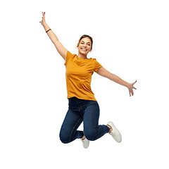 Image showing happy young woman or teenage girl jumping