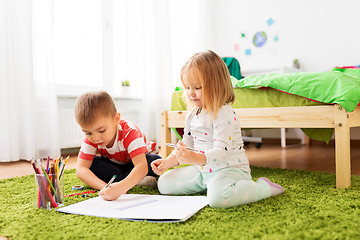 Image showing happy kids drawing at home