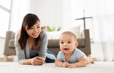 Image showing sweet little asian baby boy with mother at home