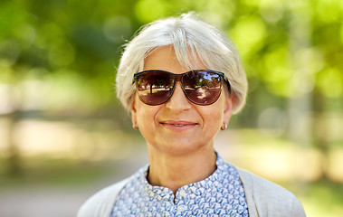 Image showing portrait of happy senior woman at summer park