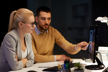 Image showing designers with mockup on computer screen at office