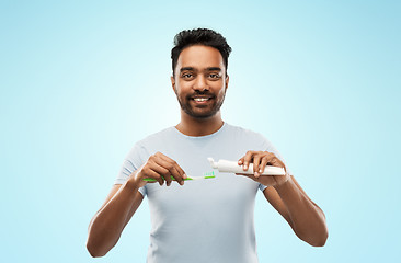 Image showing indian man with toothbrush and toothpaste