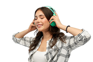 Image showing happy young woman or teenage girl with headphones