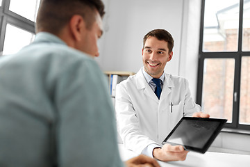 Image showing doctor with tablet computer and patient at clinic