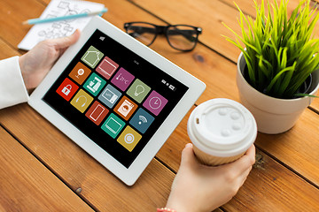 Image showing hands with smart home icons on tablet computer