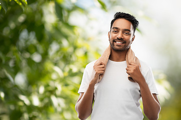 Image showing smiling indian man with towel