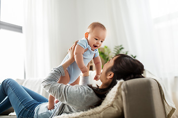 Image showing happy mother with little baby son at home