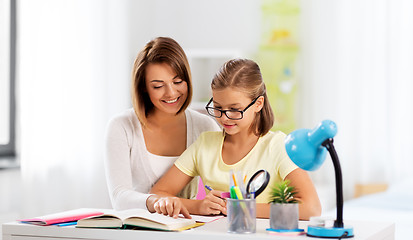 Image showing mother and daughter doing homework together