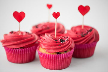 Image showing close up of cupcakes with heart cocktail sticks