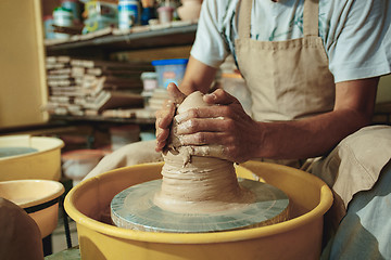 Image showing Creating a jar or vase of white clay close-up. Master crock.